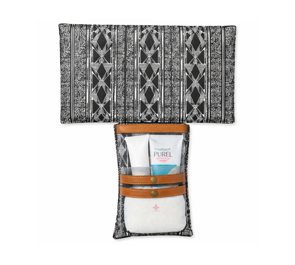 Humba Hides Travel Clutch – An open Portable Nappy Changing Station showing African Stripe pattern in waterproof material and genuine leather backing on a white background