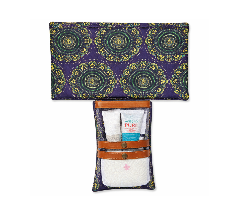 Humba Hides Travel Clutch – An open Portable Nappy Changing Station showing Mandala Shweshwe pattern in waterproof material and genuine leather backing on a white background